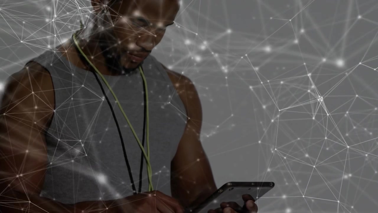 Man tapping tablet and navigating network graphic in tech demo, revealing subtle smile