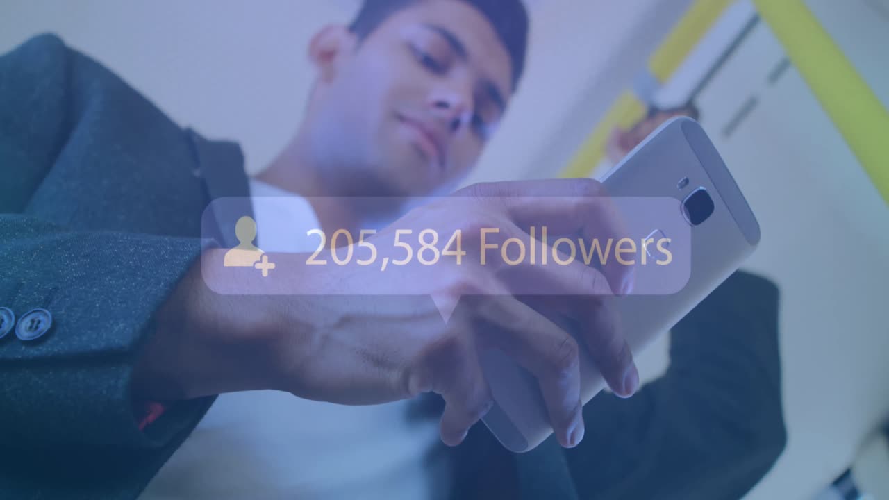 Animation of increasing followers on a speech bubble over biracial man using a smartphone in a bus