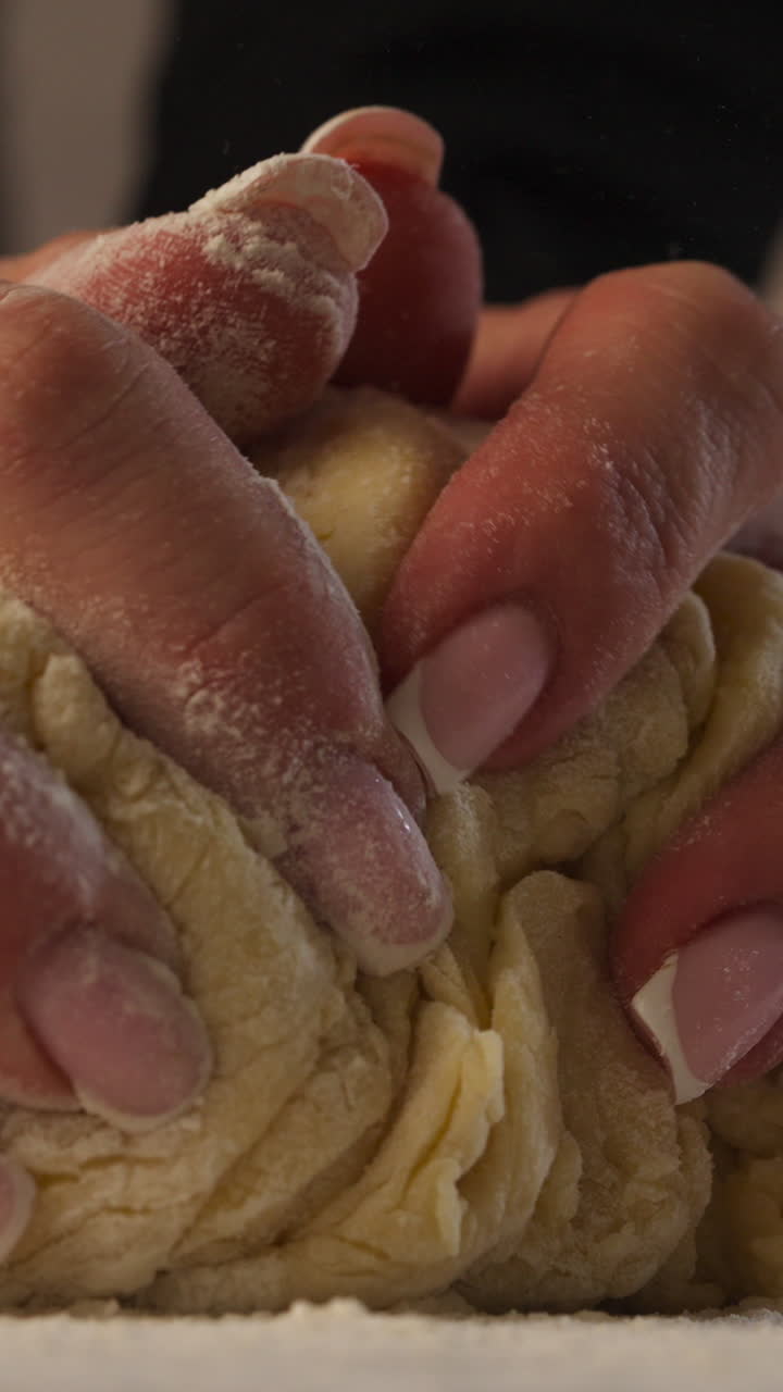 Dusting Flour Before Kneading Dough To Prevent Sticking To The Surface. - vertical shot