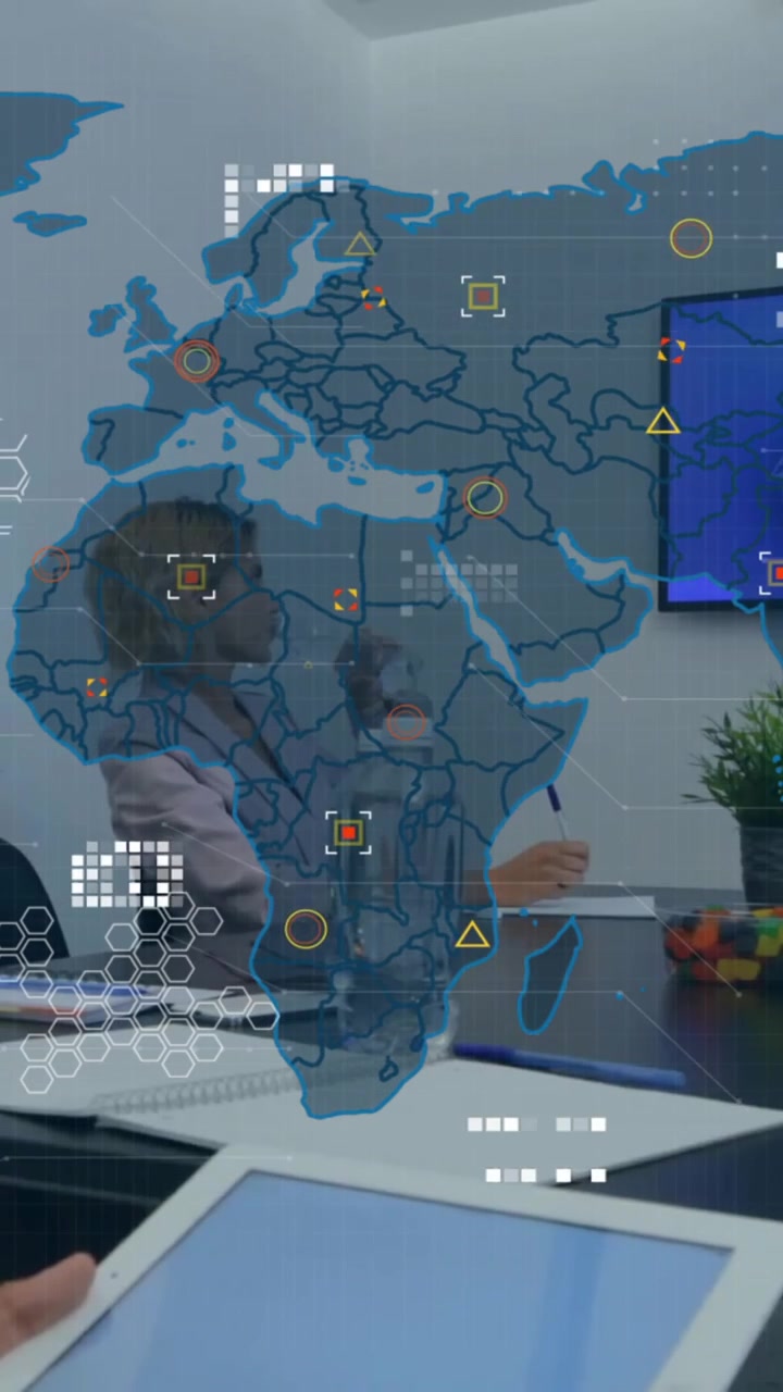 Animation of world map and financial data processing over diverse business people in office