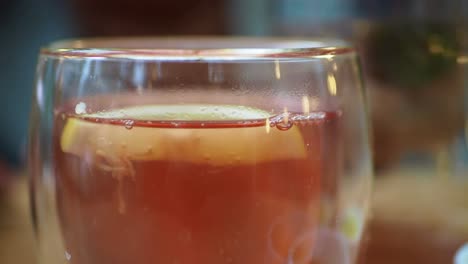 close up of a glass of lemon tea