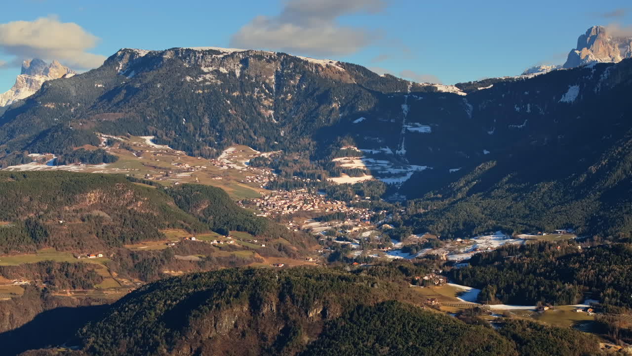 Aerial drone view of the Soprabolzano village on the Renon plateau in the Dolomites, Italy