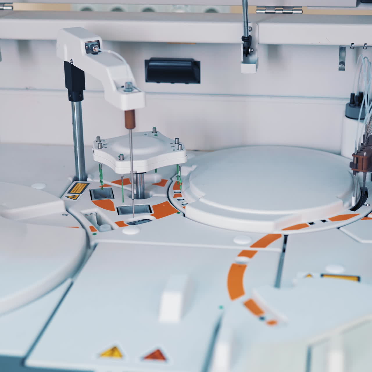 Modern robotic machine of checking blood samples in process in the laboratory. Analysis of liquid at medical clinic. Reseach and science concept. Slow motion.