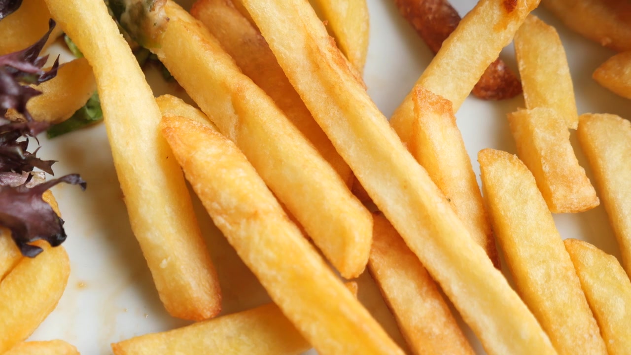 Close-up of Golden Crispy French Fries on a Plate