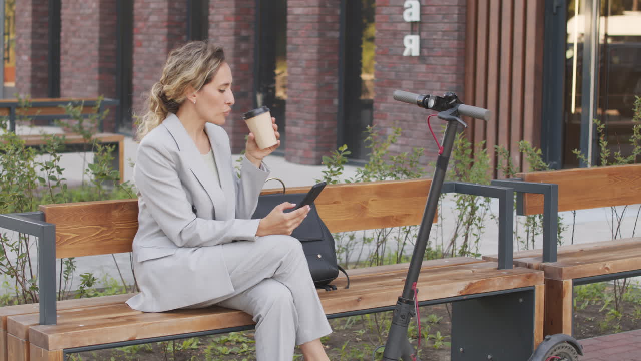 Businesswoman Drinking Coffee Outdoors