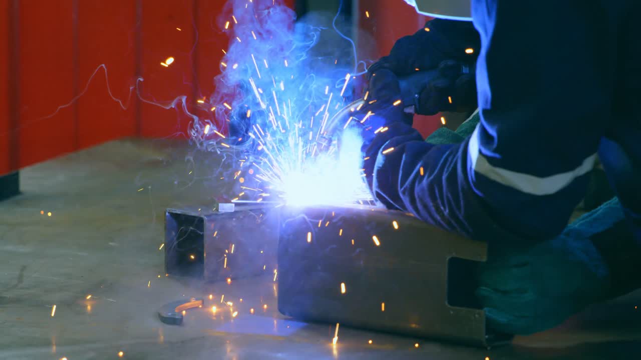 Robotic engineer welding metal in robotic warehouse 4k