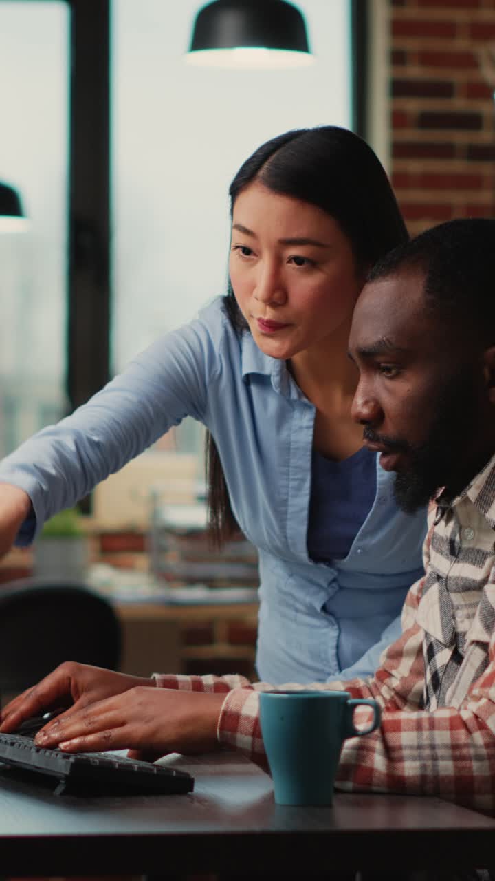 Vertical video: African american and asian people doing teamwork