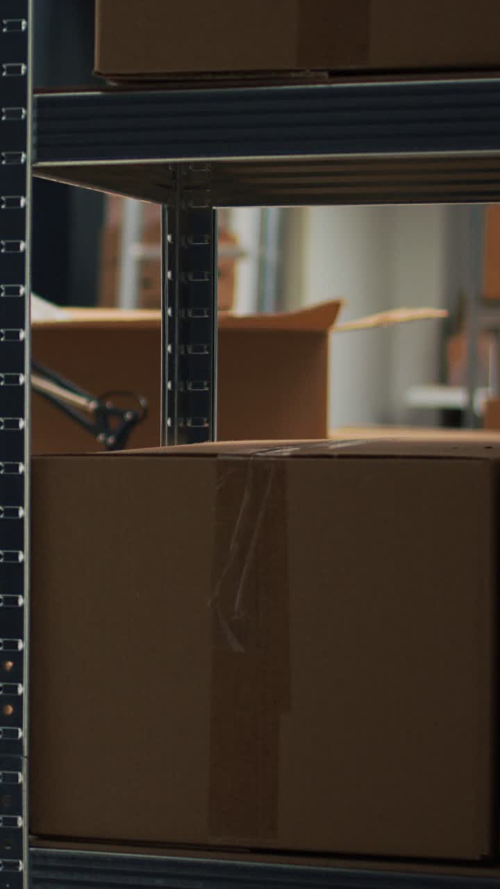Vertical video: Storehouse filled with raw materials on shelves to put carton packages
