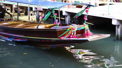 colorful boat navigating khlong lat mayom canal