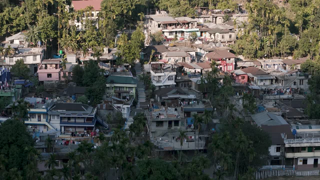 Aerial view of Shnongpdeng village built on a steep, jungle-covered mountainside in the gorges of Meghalaya, India