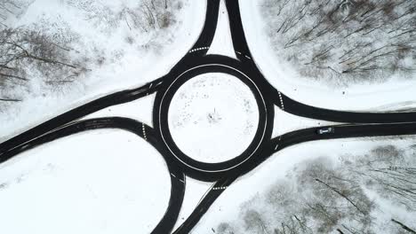 traffic circle and snow-covered landscape - aerial view