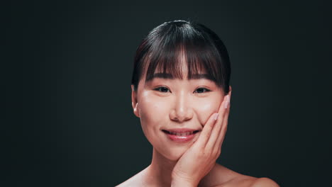 close-up portrait of a happy young woman with healthy glowing skin