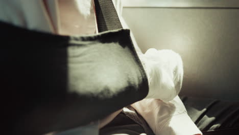 Closeup-boy-broken-arm-wrapped-in-plaster-cast.-Teenager-sitting-schoolbus.