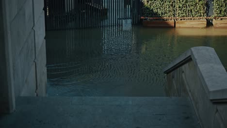 flooded steps leading to water-covered walkway in budapest, hungary during 2024 flood