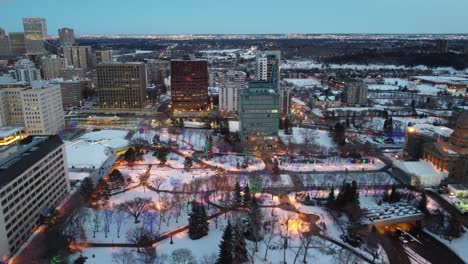 1-3 aerial flyer over winter frestive city riverside historic ledgislature park skyline hometown forest nature sleigh bells christmas lights on buildings trees paths to subway system underground mall