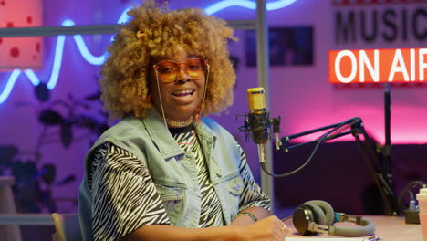 woman radio host in a trendy studio
