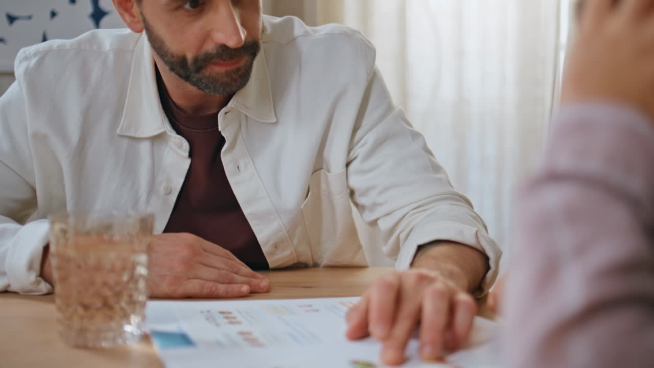 Smiling father talking child at light living room closeup. Man communicating son