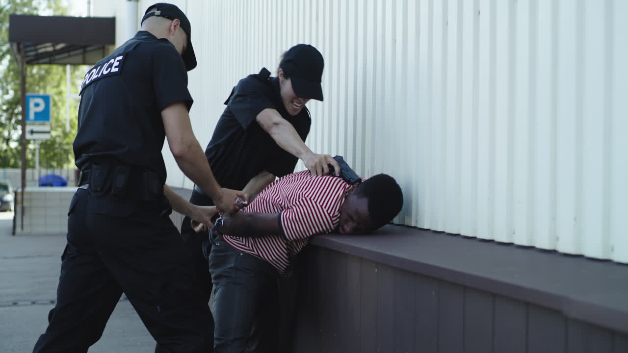 Police officers arresting a suspect