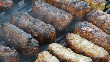 Traditional-food-Meat-Balls-"mici"-on-grill