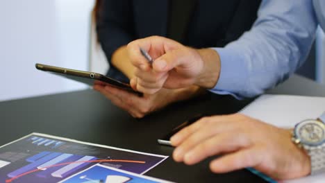 business colleagues discussing over digital tablet 4k