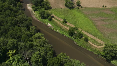 River-Surrounded-With-Lush-Vegetation-In-Oronoco,-Minnesota,-USA---aerial-shot