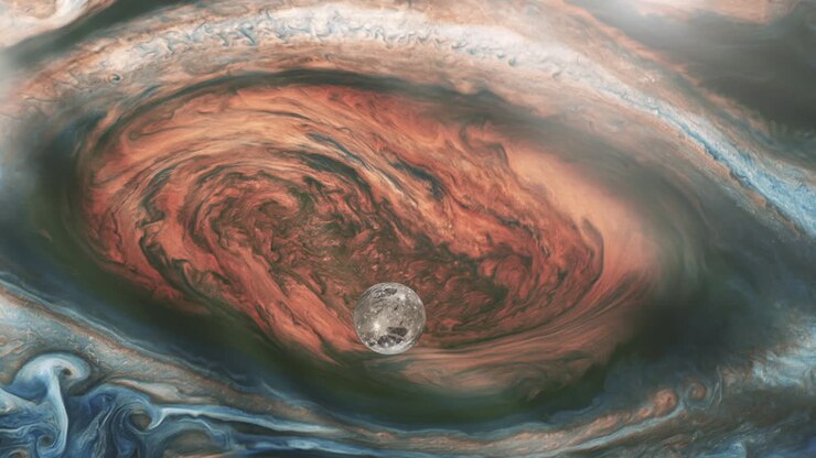Ganymede, one of the four Galilean Moons, orbiting Jupiter and passing over the Great Red Spot. Elements of this Video furnished by NASA. 4K Resolution.