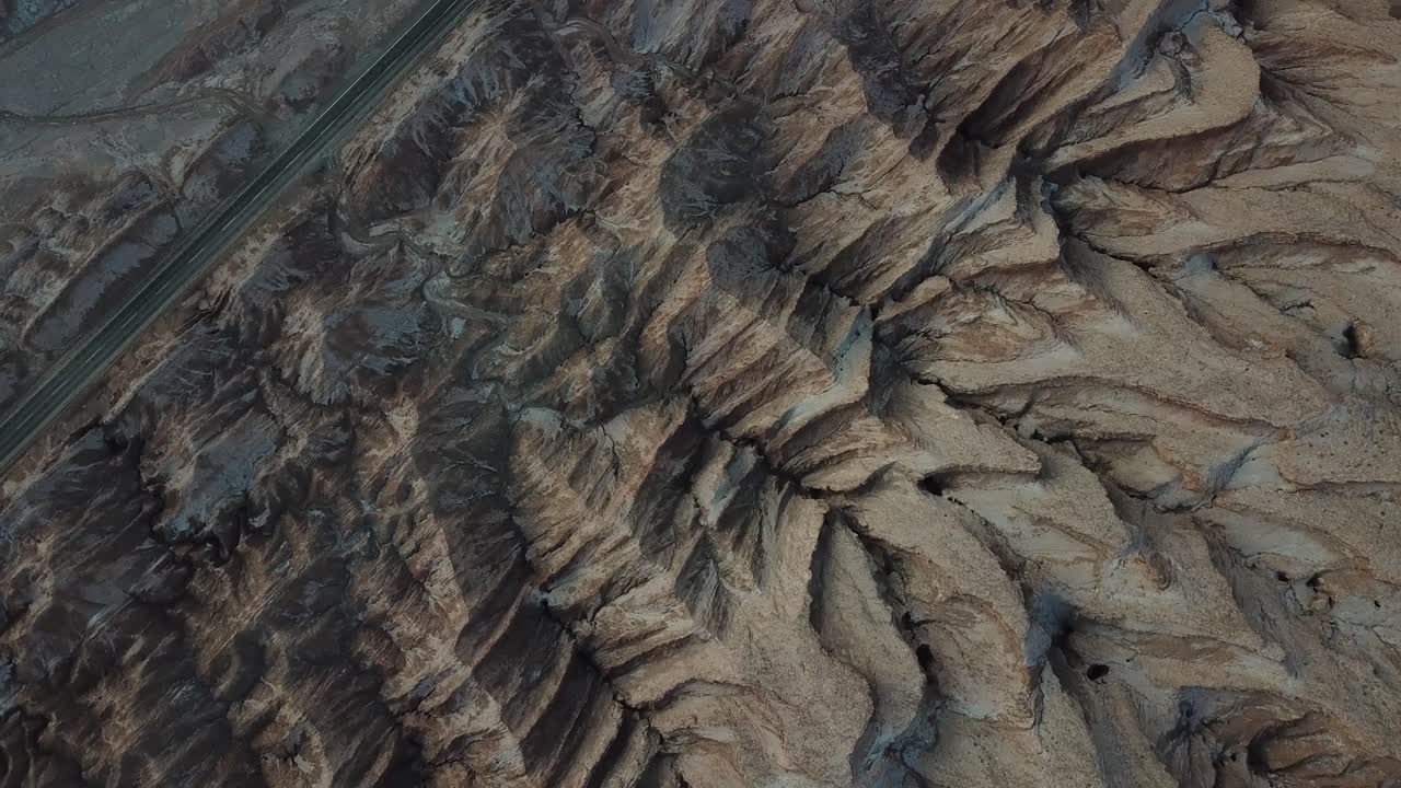 Top Down Aerial View of Freeway Road Under Atacama Desert Hills, Chile