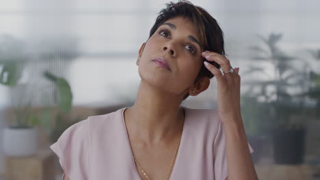 portrait-beautiful-young-hispanic-business-woman-running-hand-through-hair-looking-pensive-wearing-stylish-fashion-in-office-slow-motion-successful-female-entrepreneur