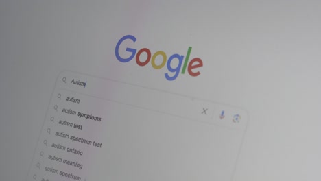 autism being searched on google., close up shot of a computer monitor screen.