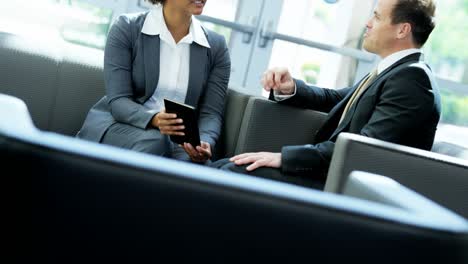 multi ethnic real estate team with wireless tablet