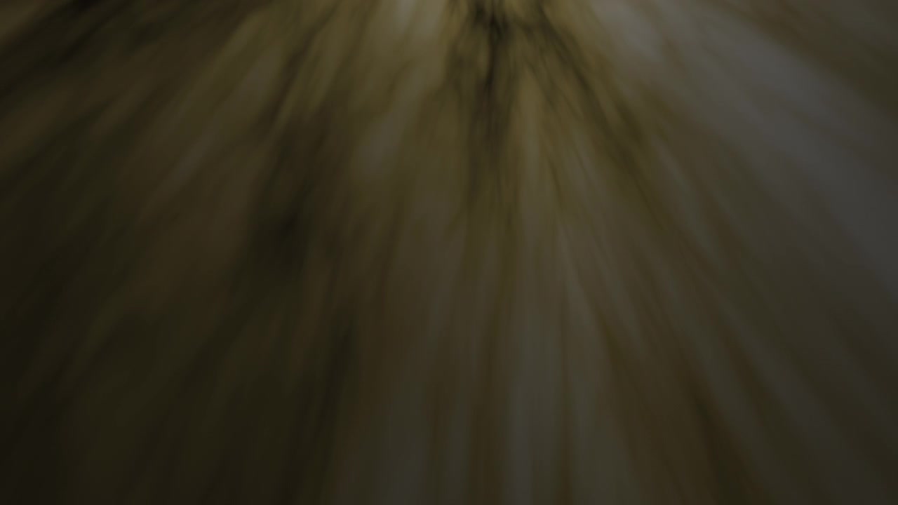 Abstract Golden Light Rays Moving Through Dark Background