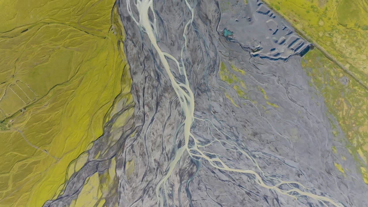 Top down drone shot over a river delta, sunny, summer day in Iceland