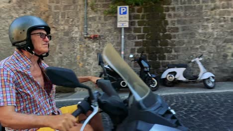 moped journey along cobblestone road in sorrento