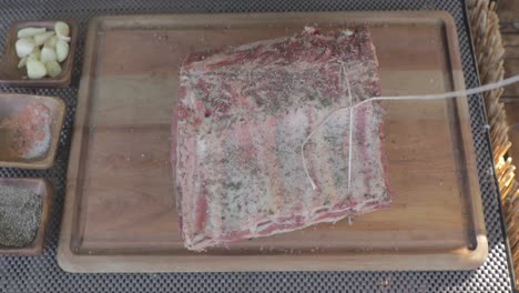 preparing a prime rib roast: seasoning and tying