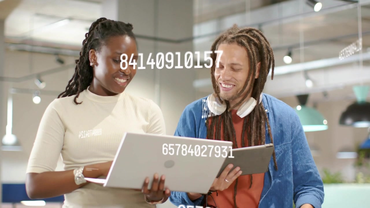 Vertical video: Laptop angling toward man, team pointing pad and reviewing PC while data floating
