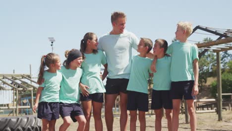group of caucasian boys and girls at boot camp together