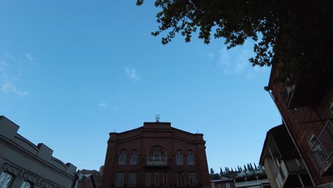 The-great-synagogue-of-Tbilisi-the-holy-religious-place-of-worship-for-Jewish-in-Georgian-Caucasus-in-down-town-the-historical-building-ancient-architecture-brick-building-ceremony-of-Hanukah