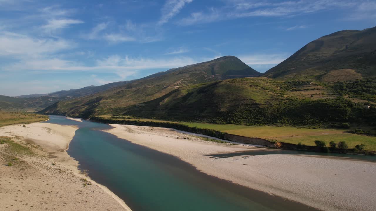 Beautiful river colorful landscape with emerald water, mountains and lush vegetation in Albania