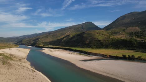 beautiful river colorful landscape with emerald water, mountains and lush vegetation in albania