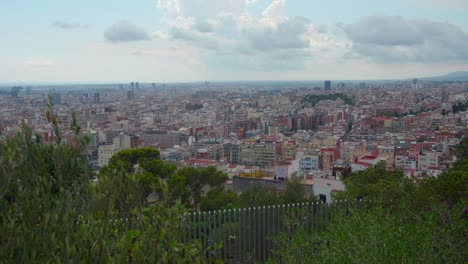 urban landscape of barcelona city as seen from park guell in carmel hill, barcelona, spain