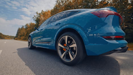audi e tron profile view. audi e tron, a fully electric car on highway