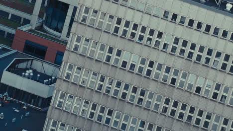 exterior of a multi-story building with regularly patterned windows