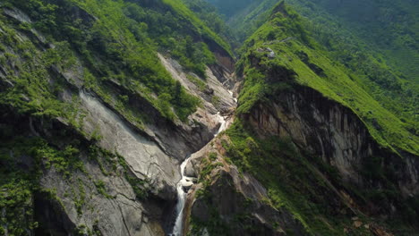 drone shot of wonderful waterfall from mustang nepal with the top view of the waterfall is seen