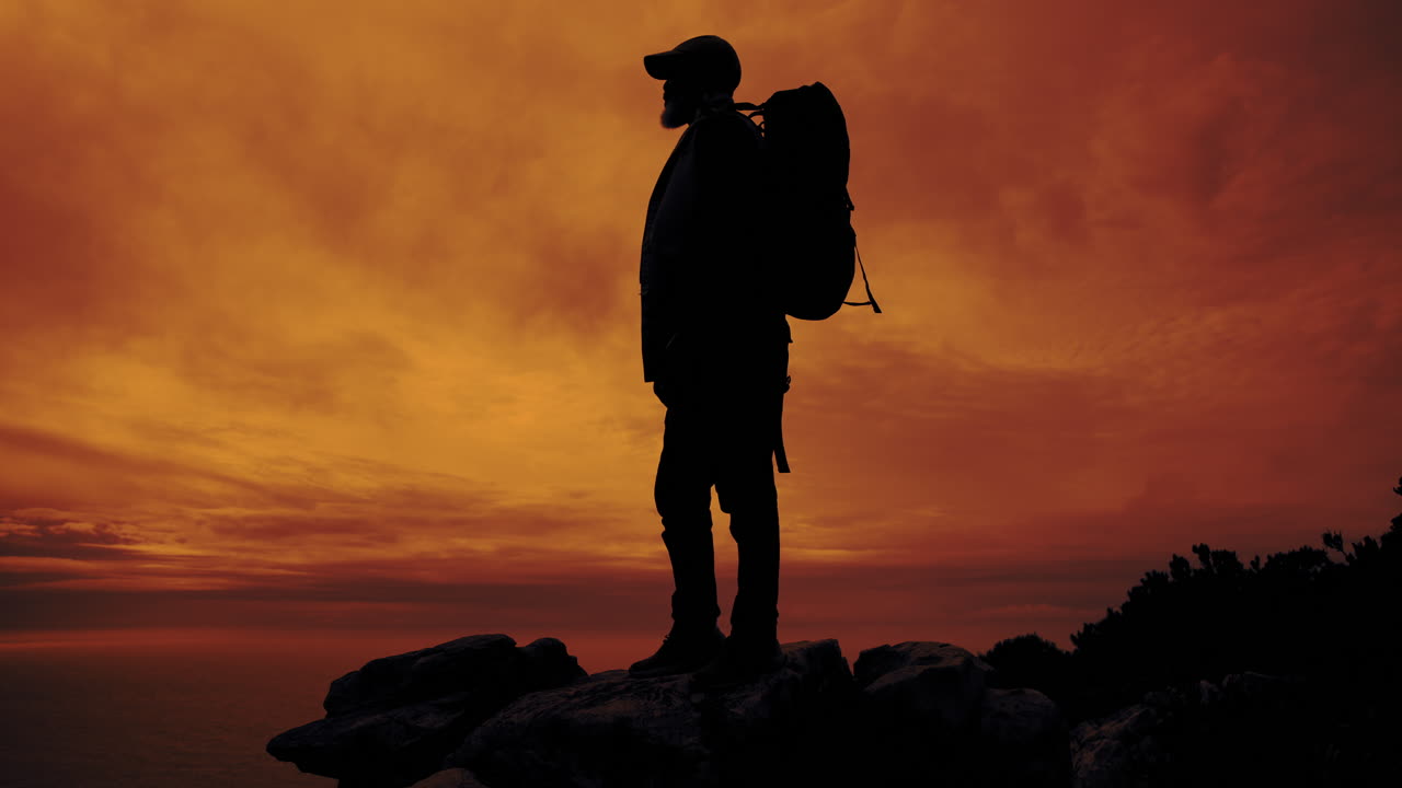 Silhouette of a Backpacker at Sunset