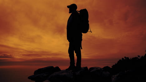 silhouette of a backpacker at sunset