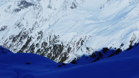 snowy alpine peaks on a sunny, winter day in the alps of tyrol - tilt view