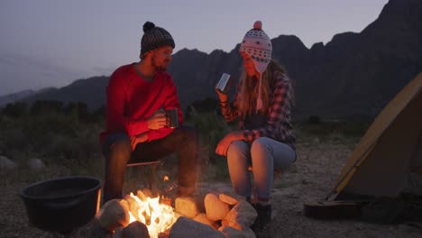 caucasian couple camping in nature by night