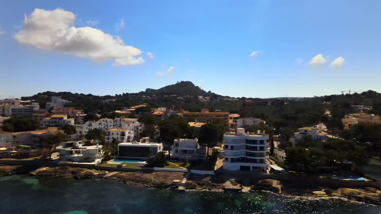 Enjoy sweeping vistas of Santa Ponsa in Mallorca, showcasing pristine coastal landscapes and charming whitewashed buildings. The vibrant atmosphere and natural beauty are captured beautifully.
