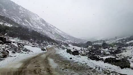 snowfall in himalayan snow cap mountains at morning