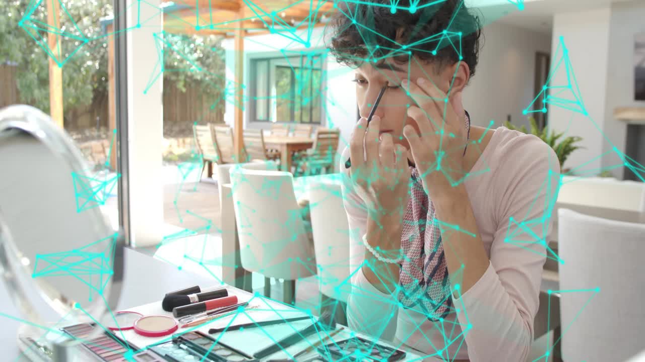 Man reaching for wand and applying eyeliner, cyan network tracing eye area for beauty demo